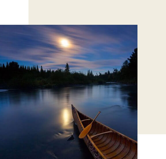 A canoe on a lake at night.